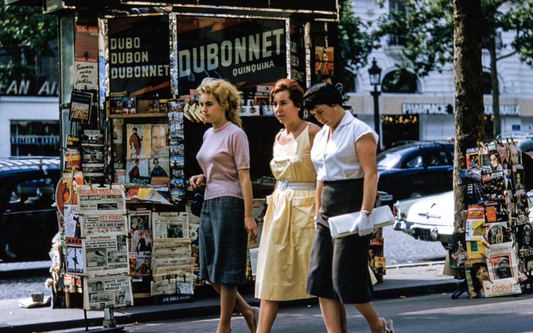 three women walking on road